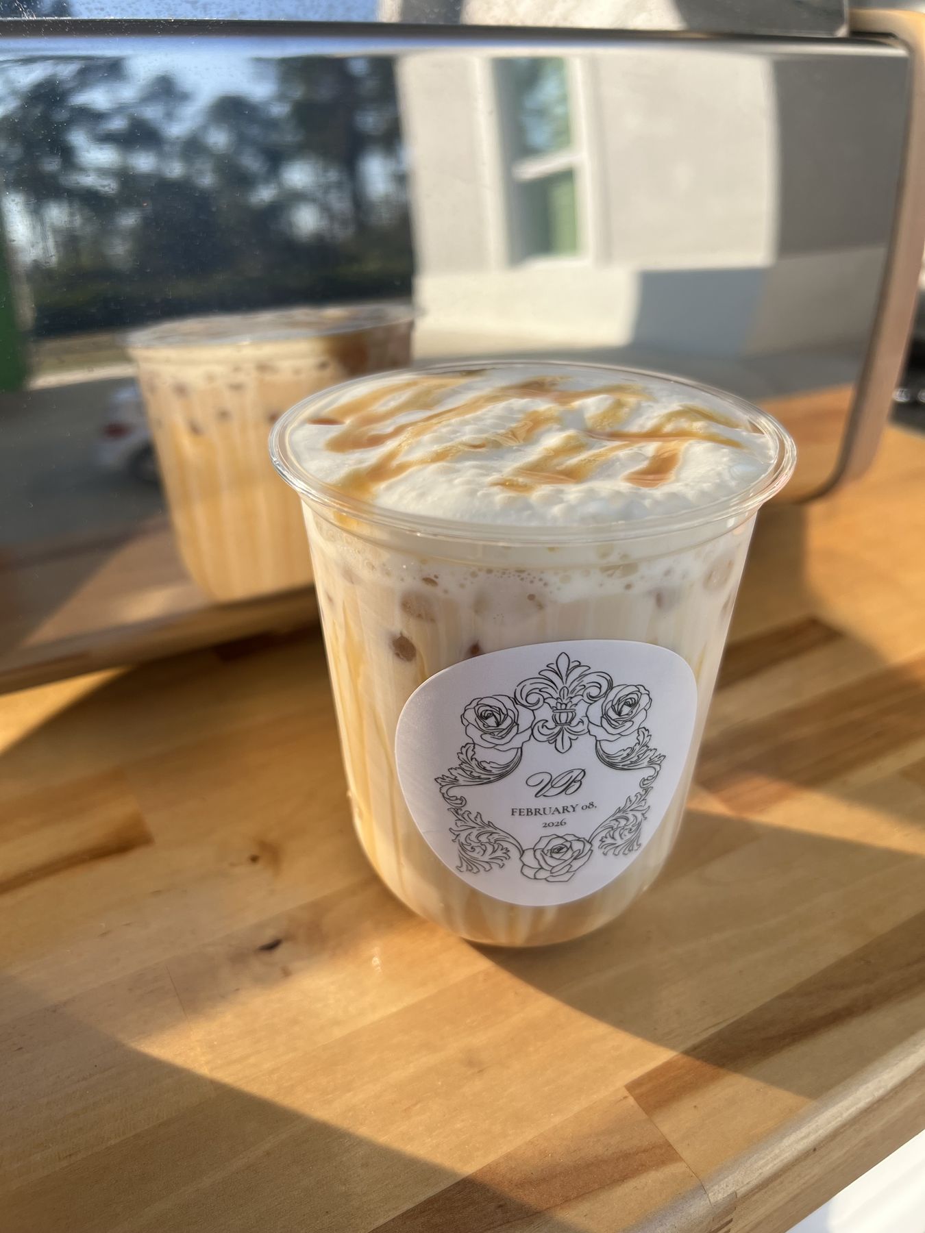 Iced latte with a custom Blissful Brew label